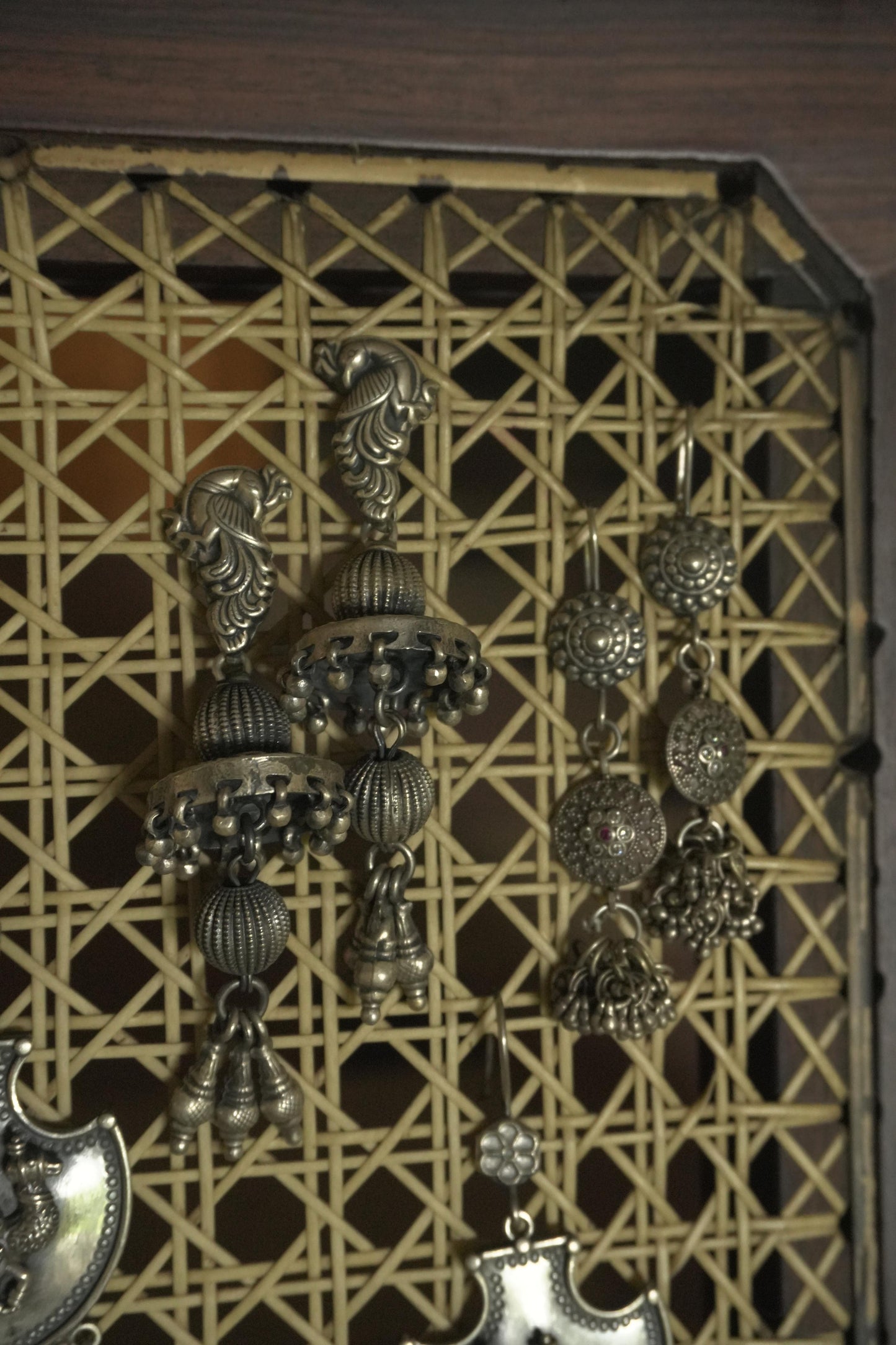 Intricate 92.5 silver tribal silver jewellery Gunjita earrings with detailed floral and geometric motifs.