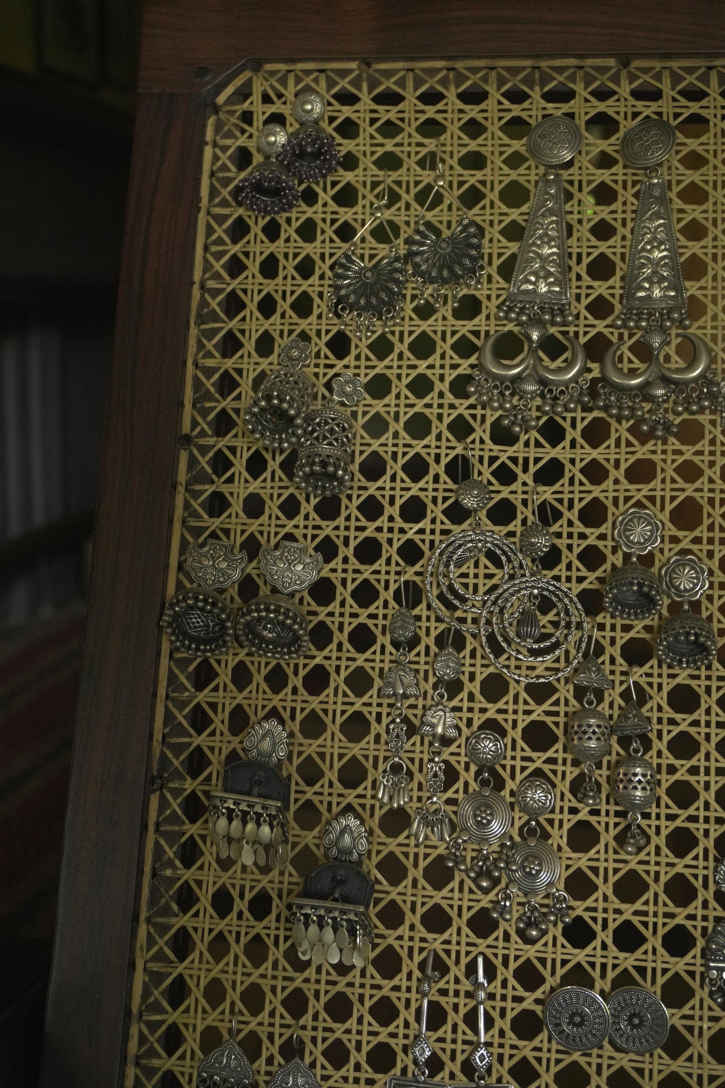 Pair of intricate tribal silver jewellery Mrdanga earrings crafted in 92.5 silver with detailed ethnic motifs.