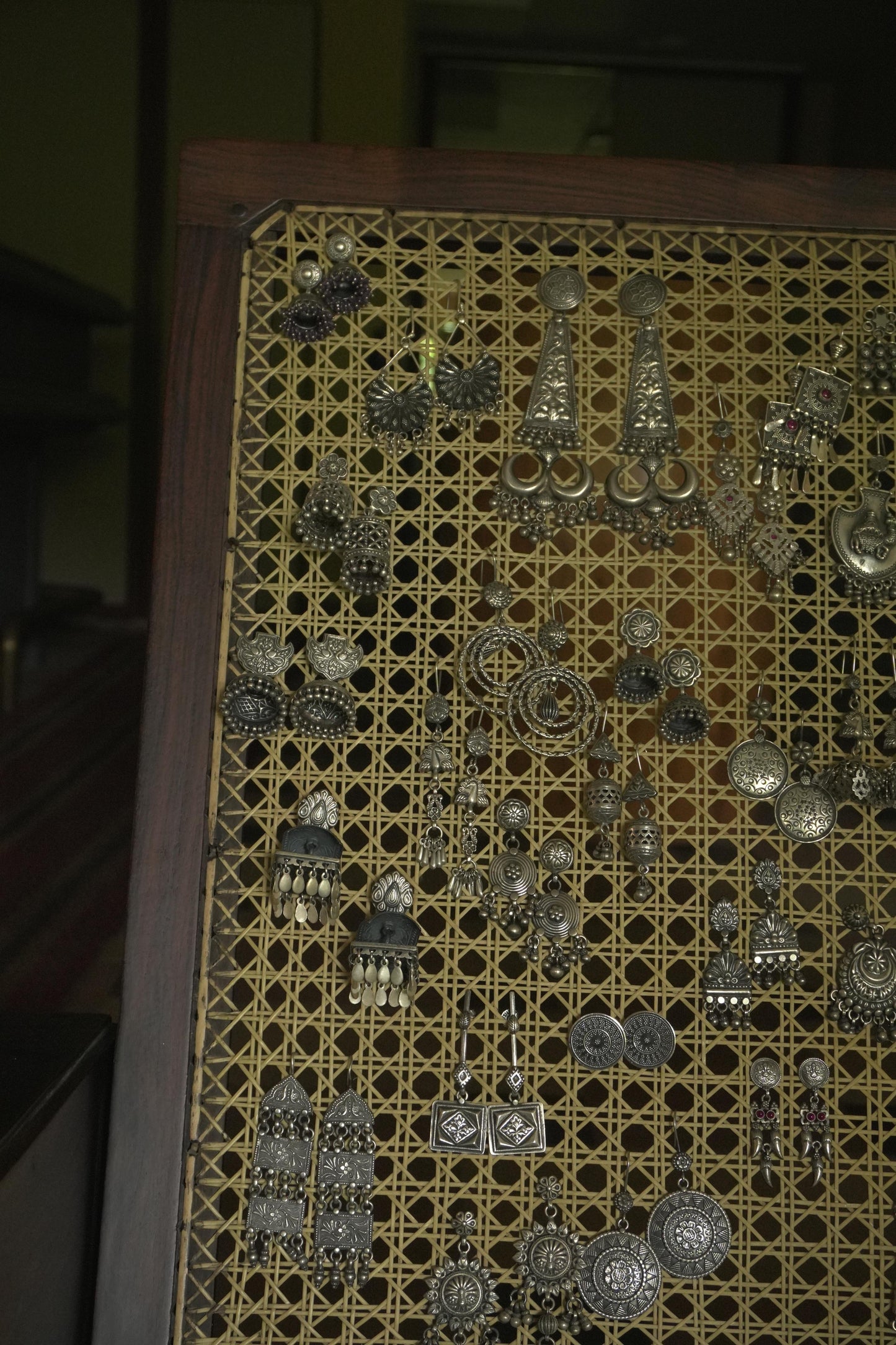 Intricate tribal silver jewellery Ravya earrings crafted from 92.5 silver with detailed patterns.