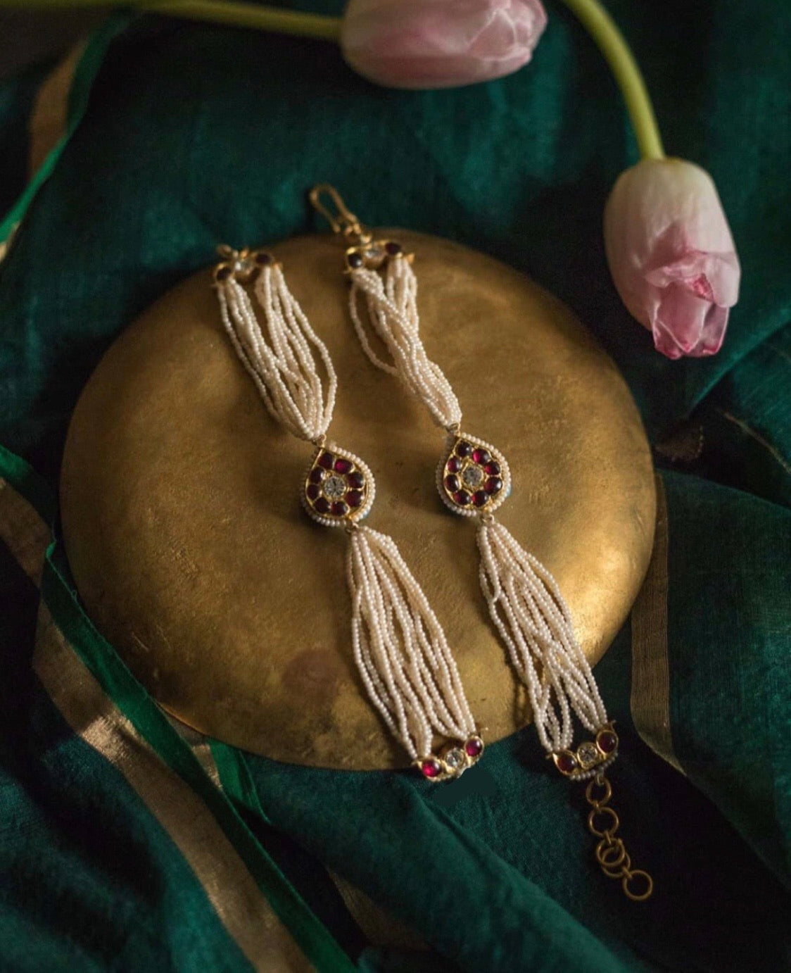 Abharika earchain cum bracelet in 92.5 sterling silver with 22ct gold gilding and red kemp stones - handcrafted temple jewelry by Aaharya