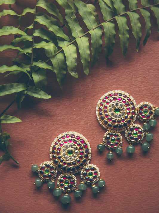 Dhanya earrings in 92.5 sterling silver with 22ct gold leaf, featuring red and green kemp stones in circular design