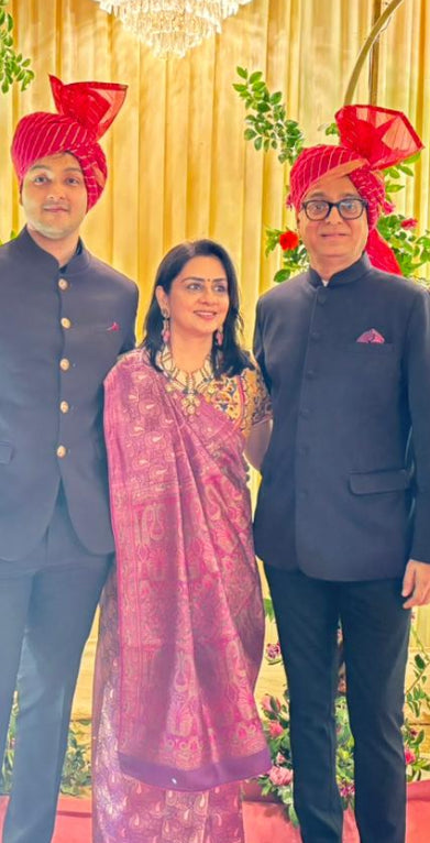 Abharika temple necklace worn at Indian wedding celebration with burgundy saree and traditional jewelry