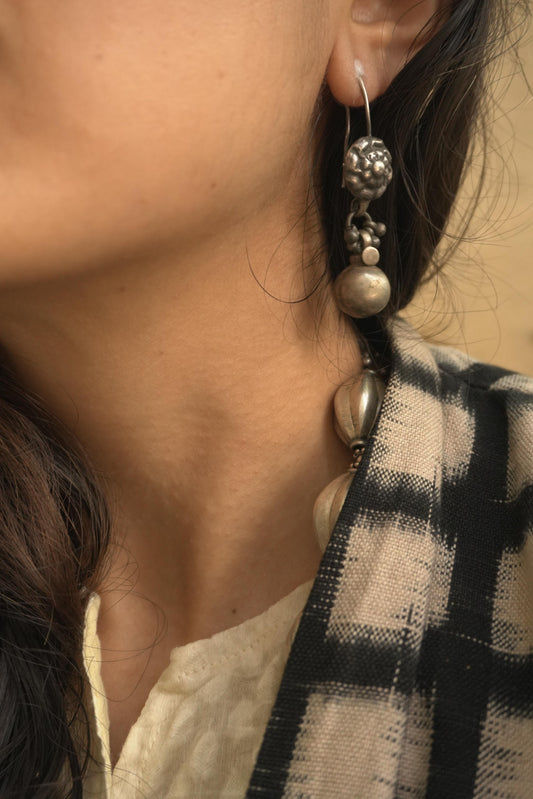 Tribal silver jewellery Manjiri earrings in 92.5 silver with intricate bead and ball design.