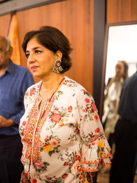 Fashion designer Gopi Vaid wearing Dhanya Studs with floral printed outfit at social event - Aaharya temple jewelry showcasing versatile styling