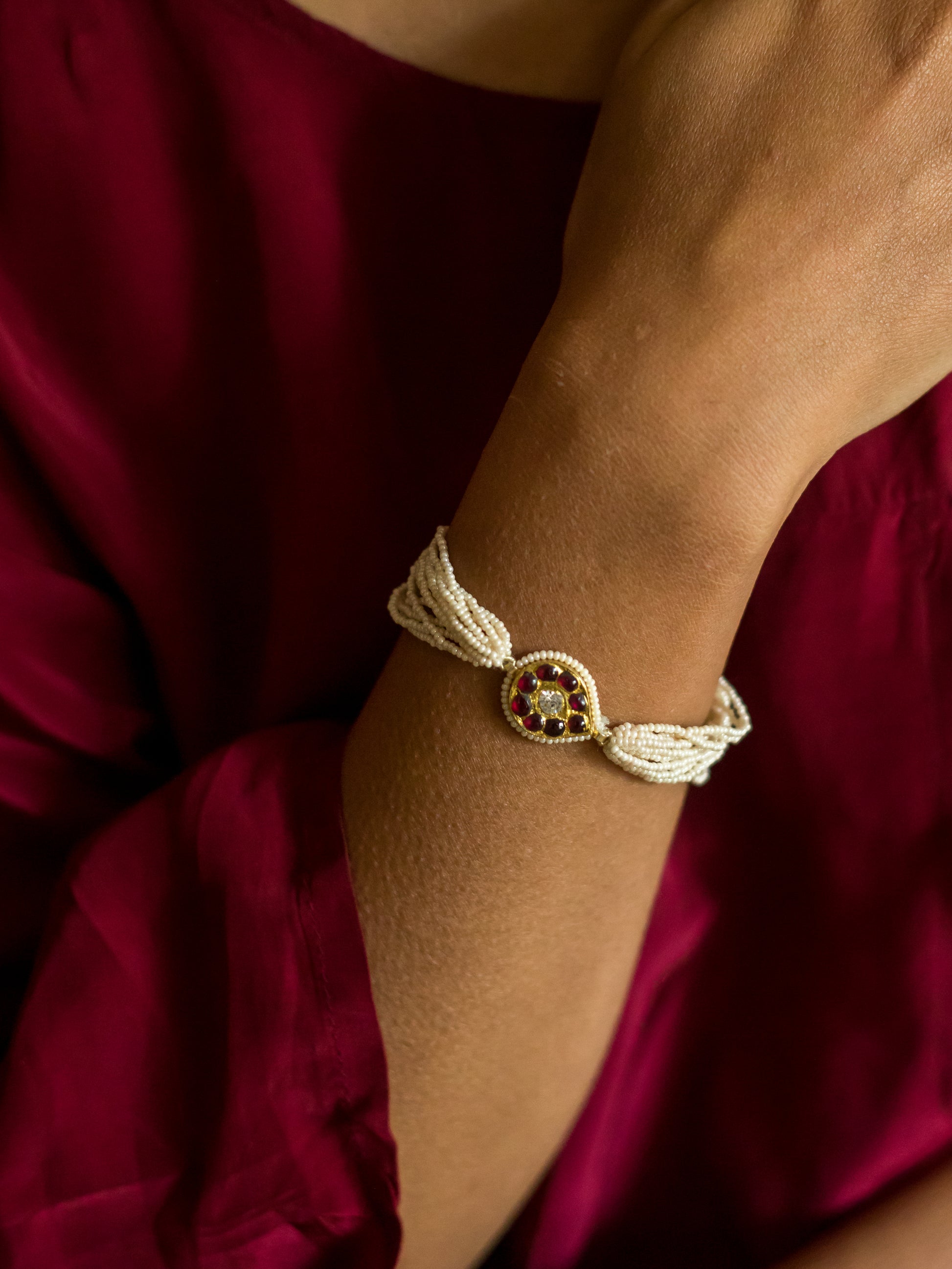 Model wearing Abharika temple bracelet cum earchain - traditional Indian temple jewelry by Aaharya 