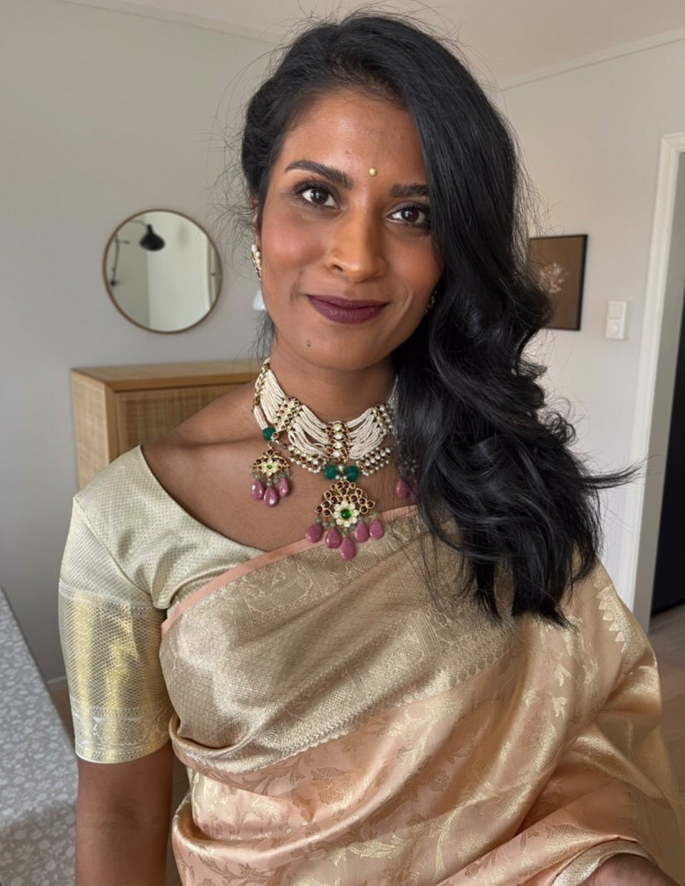 Abharika temple necklace with kemp stones styled with champagne gold saree - close-up lifestyle shot