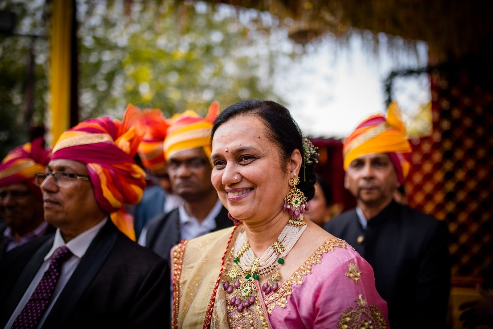 Mother of Bride gleaming in her pink saree and jewels by Aaharya , specifically in the Abharika set 